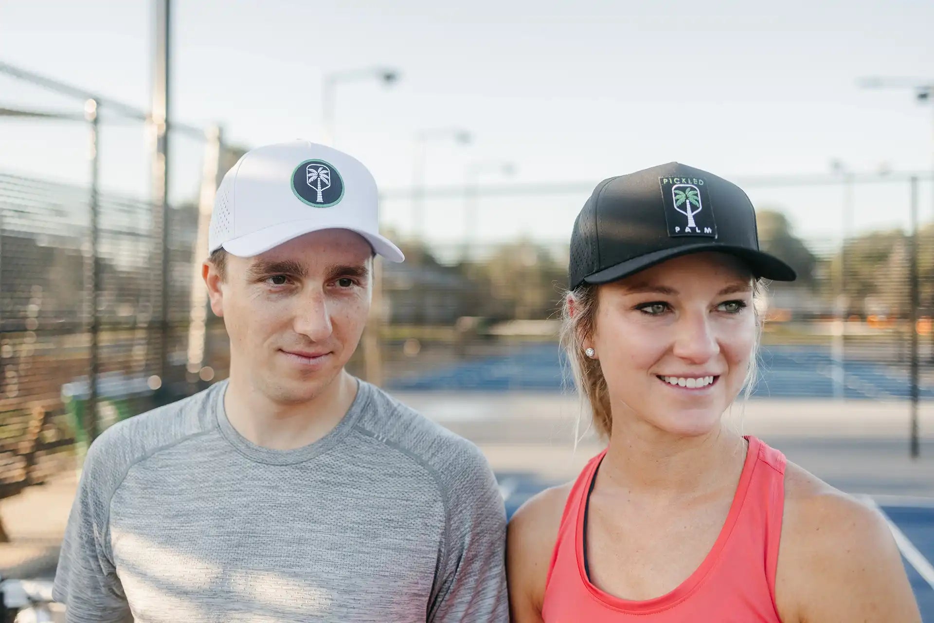 Players wearing Pickled Palm performance pickleball hats on court