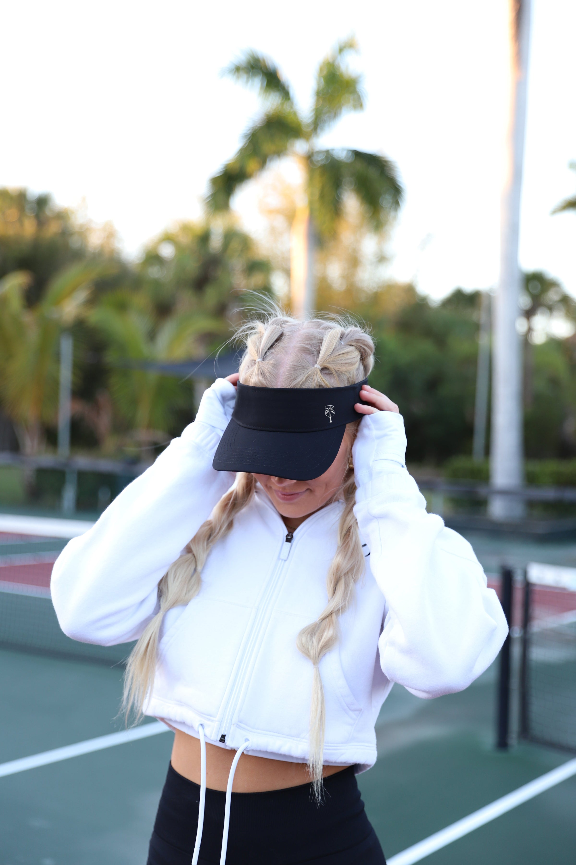 The Evening Black Pickleball Visor worn courtside