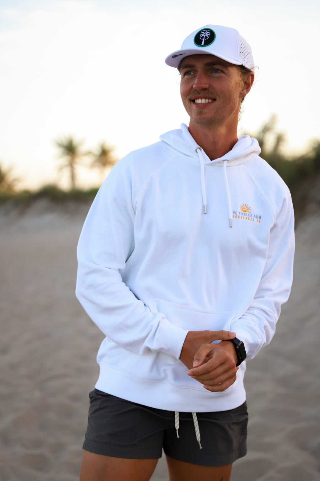 Court Side White Pickleball Hoodie, front embroidered logo on the beach | The Pickled Palm